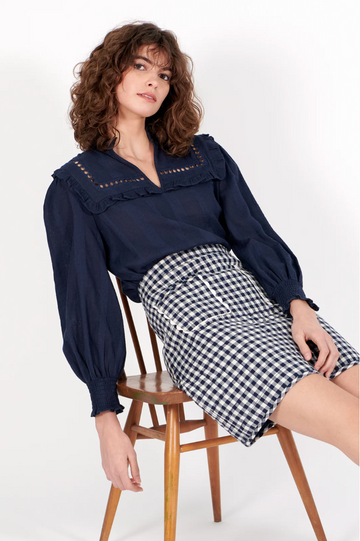 navy shirt with elasticated cuffs, ruffled collar and lace detail