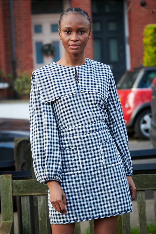 navy gingham top with bib style and raglan sleeves with elasticated cuffs 