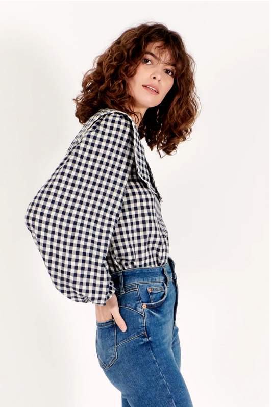 navy gingham top with bib style and raglan sleeves with elasticated cuffs  side view 