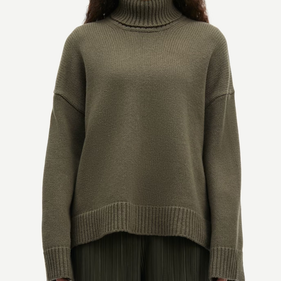 dark green turtle neck ribbed jumper with dropped shoulders