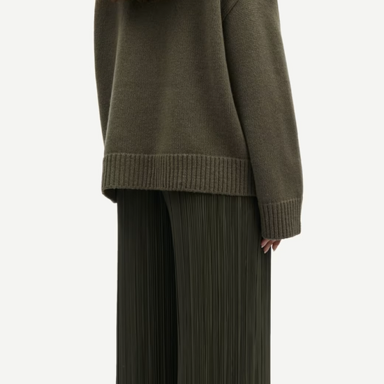 dark green turtle neck ribbed jumper with dropped shoulders rear view 