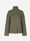 dark green turtle neck ribbed jumper with dropped shoulders