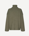 dark green turtle neck ribbed jumper with dropped shoulders rear view