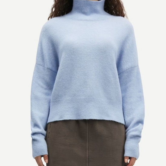 light blue turtleneck jumper with ribbed cuffs, hem and neck