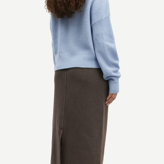 light blue turtleneck jumper with ribbed cuffs, hem and neck rear view 