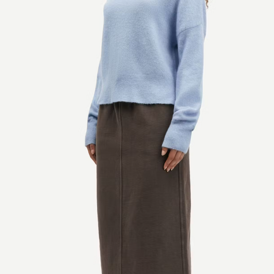 light blue turtleneck jumper with ribbed cuffs, hem and neck model shot