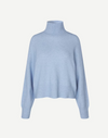 light blue turtleneck jumper with ribbed cuffs, hem and neck