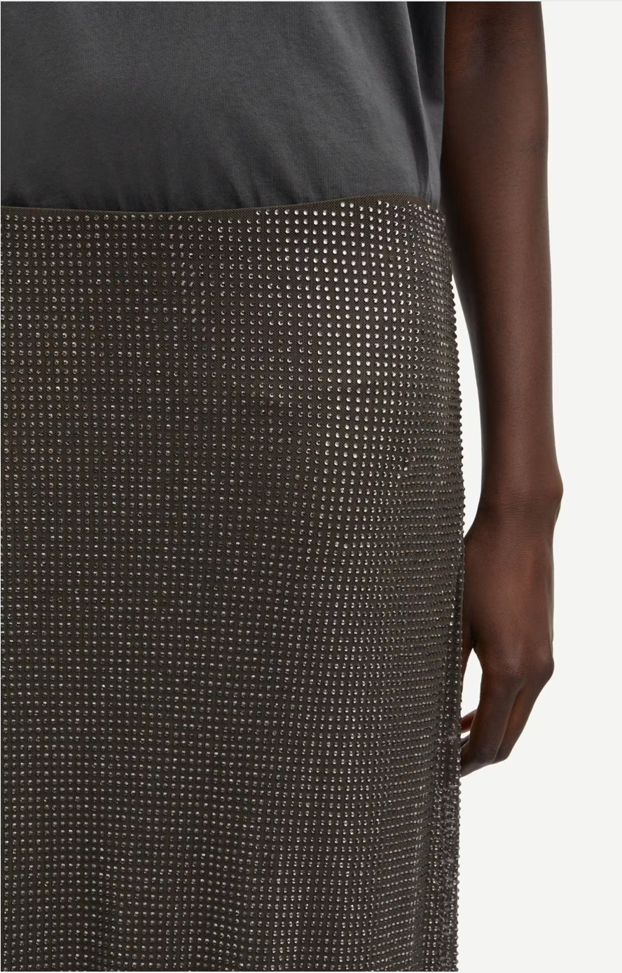 dark grey long skirt covered in rhinestones  close up