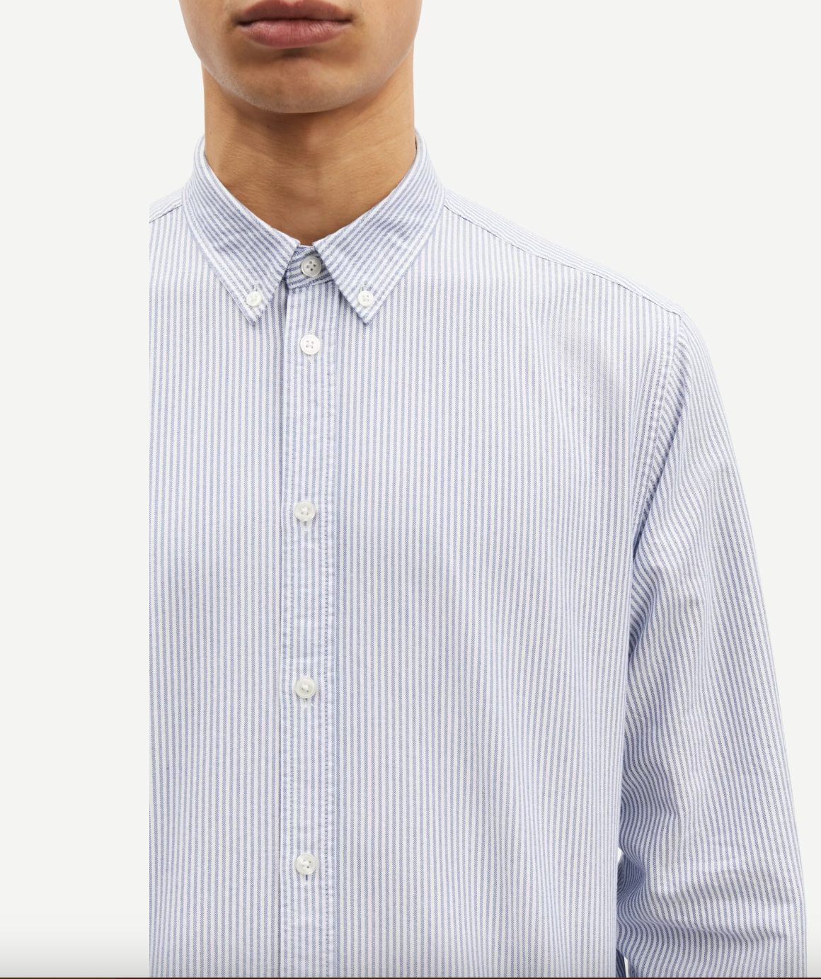 narrow blue stripe shirt with single button cuff and pleat in rear yoke  close up