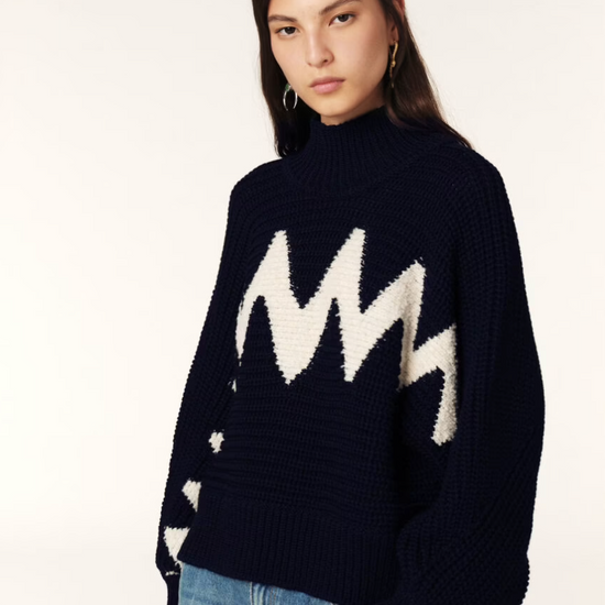 Model shot of jumper worn with denim