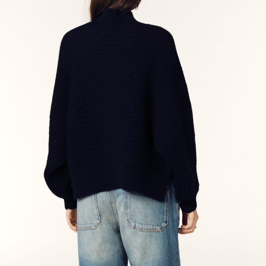 Rear view of model in navy knit