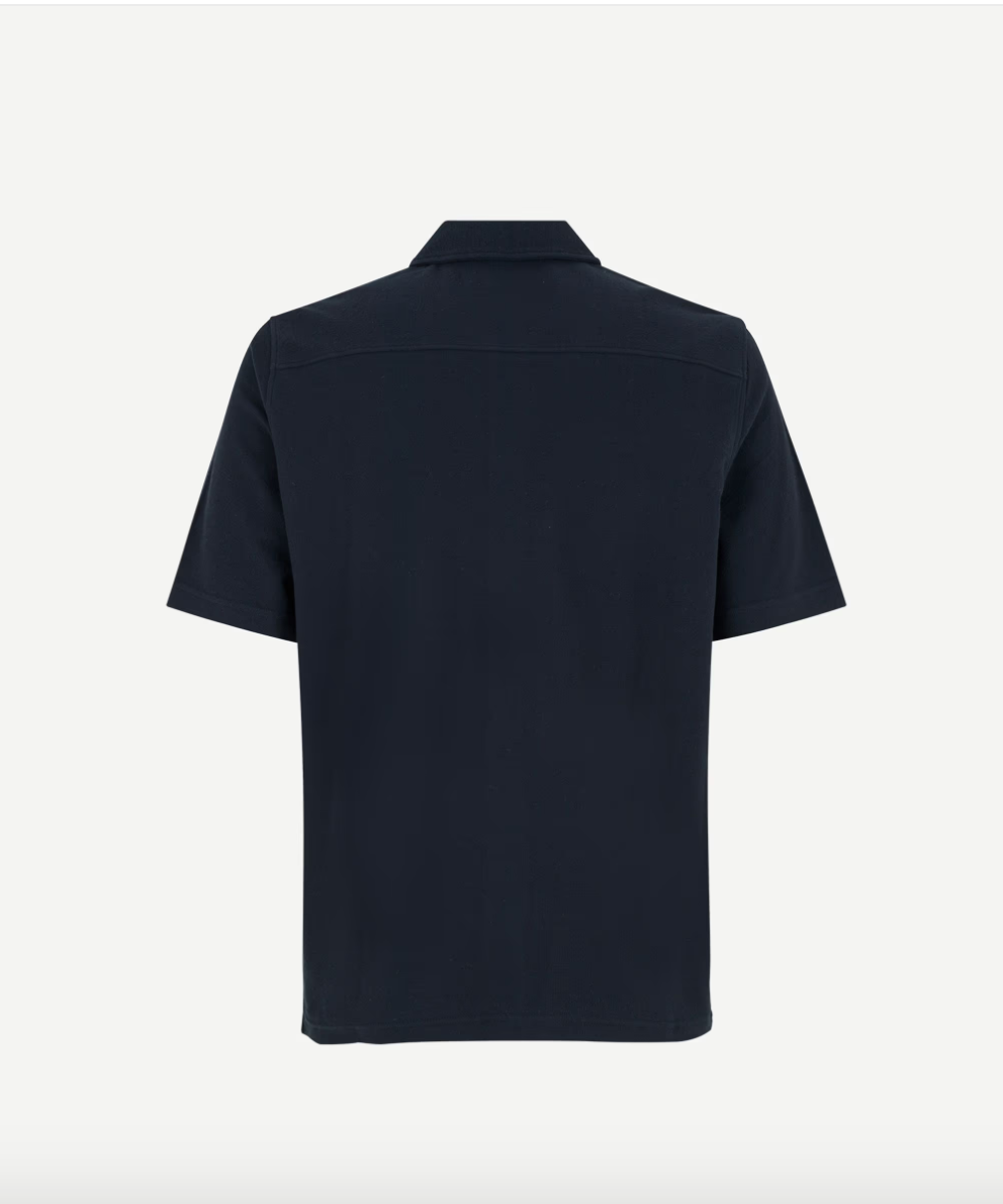 Rear flat lay of navy button through polo shirt