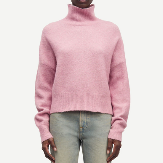 pink turtleneck jumper with ribbed neck, cuffs and hem model shot