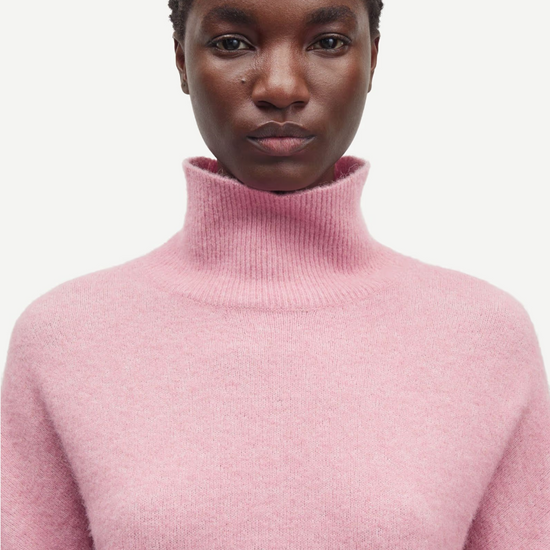 pink turtleneck jumper with ribbed neck, cuffs and hem model shot