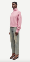 pink turtleneck jumper with ribbed neck, cuffs and hem side view