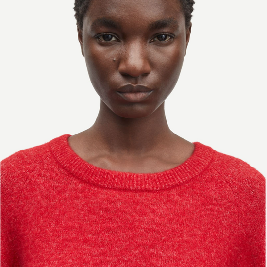 red round neck short jumper with ribbed neck, cuff and hem close up