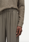 green grey pleated elasticated waist trousers close up