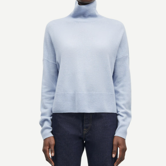 pale blue turtleneck jumper with ribbed neck, hem and cuffs model shot