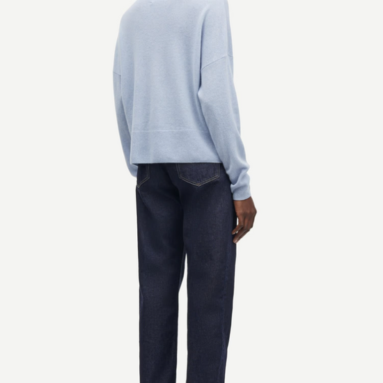 pale blue turtleneck jumper with ribbed neck, hem and cuffs rear view