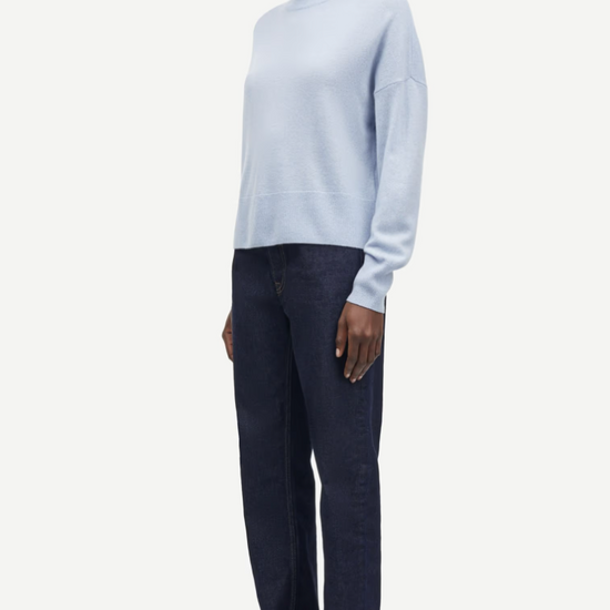 pale blue turtleneck jumper with ribbed neck, hem and cuffs side view 