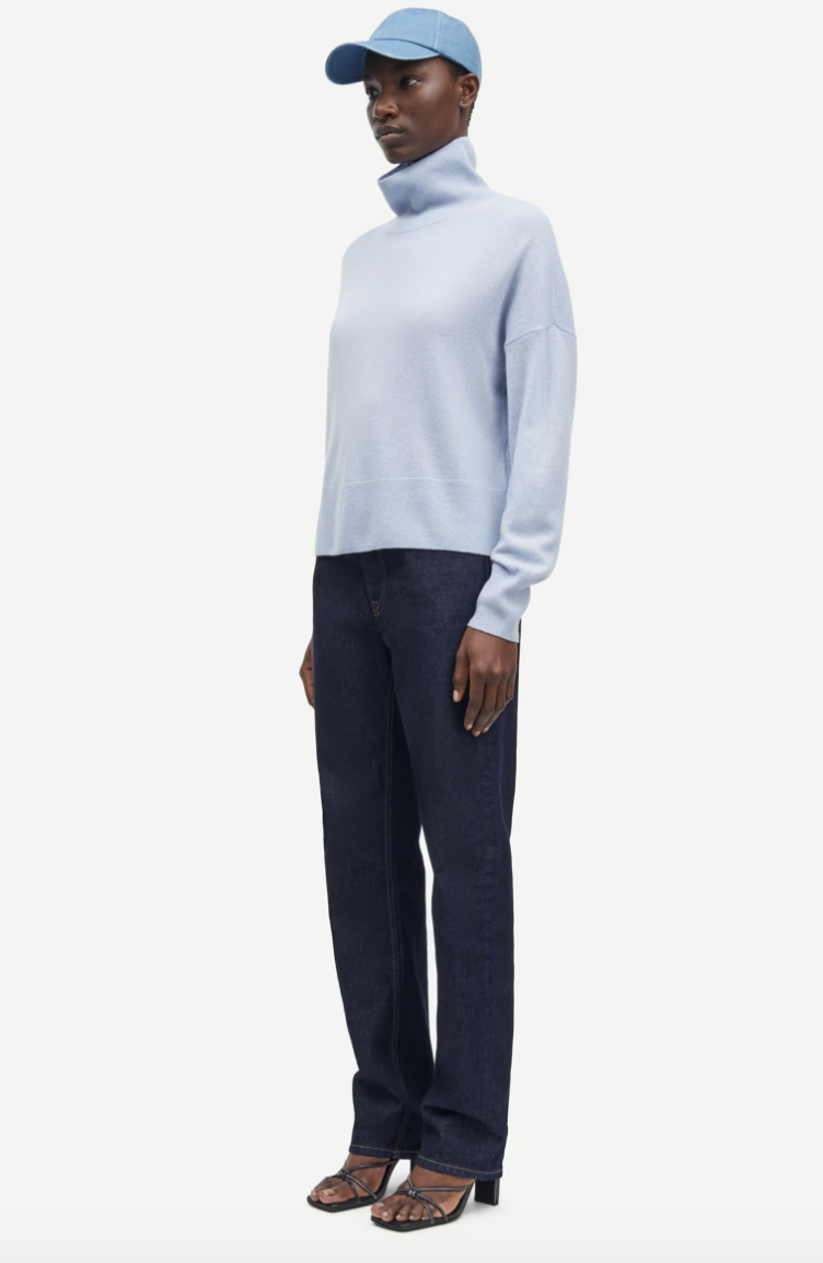 pale blue turtleneck jumper with ribbed neck, hem and cuffs side view 