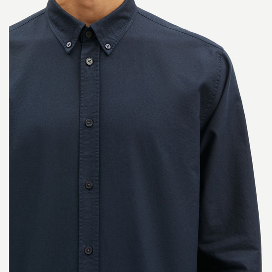 navy mens shirt with classic collar and button cuff close up