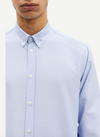 light blue mens shirt with classic collar and button cuff close up