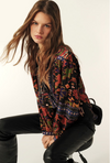 long sleeved shirt with multi coloured print and v neck side view 