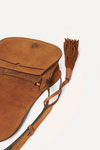 brown suede cross body bag with buckle close up