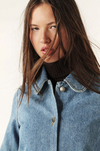 denim blue jacket with sweetheart collar and patch pocket close up 