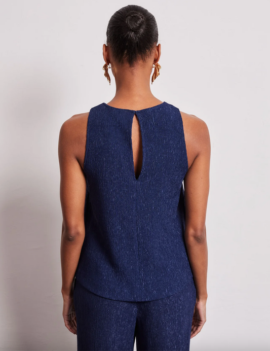 Rear view of navy crinkle fabric top with twist detail shoulder