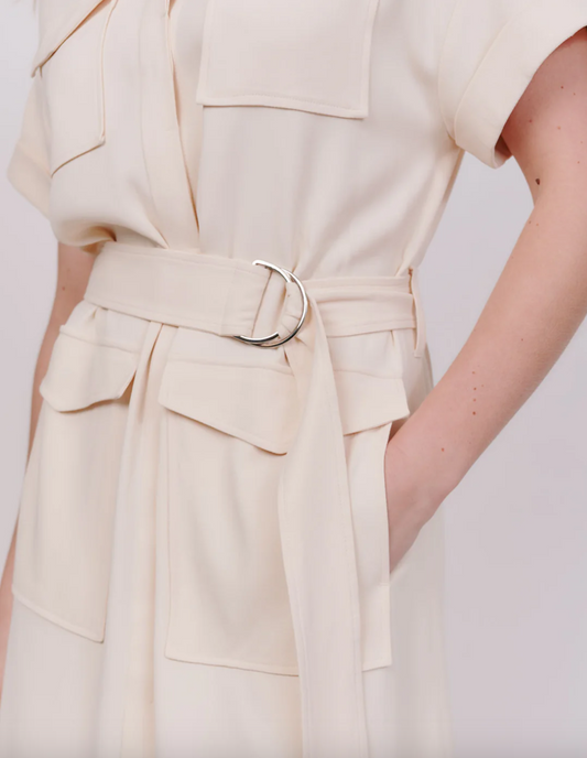 Close up of belt detail on cream shirt dress