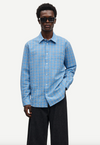 long sleeve shirt with blue check print and cheese cloth like fabric model shot