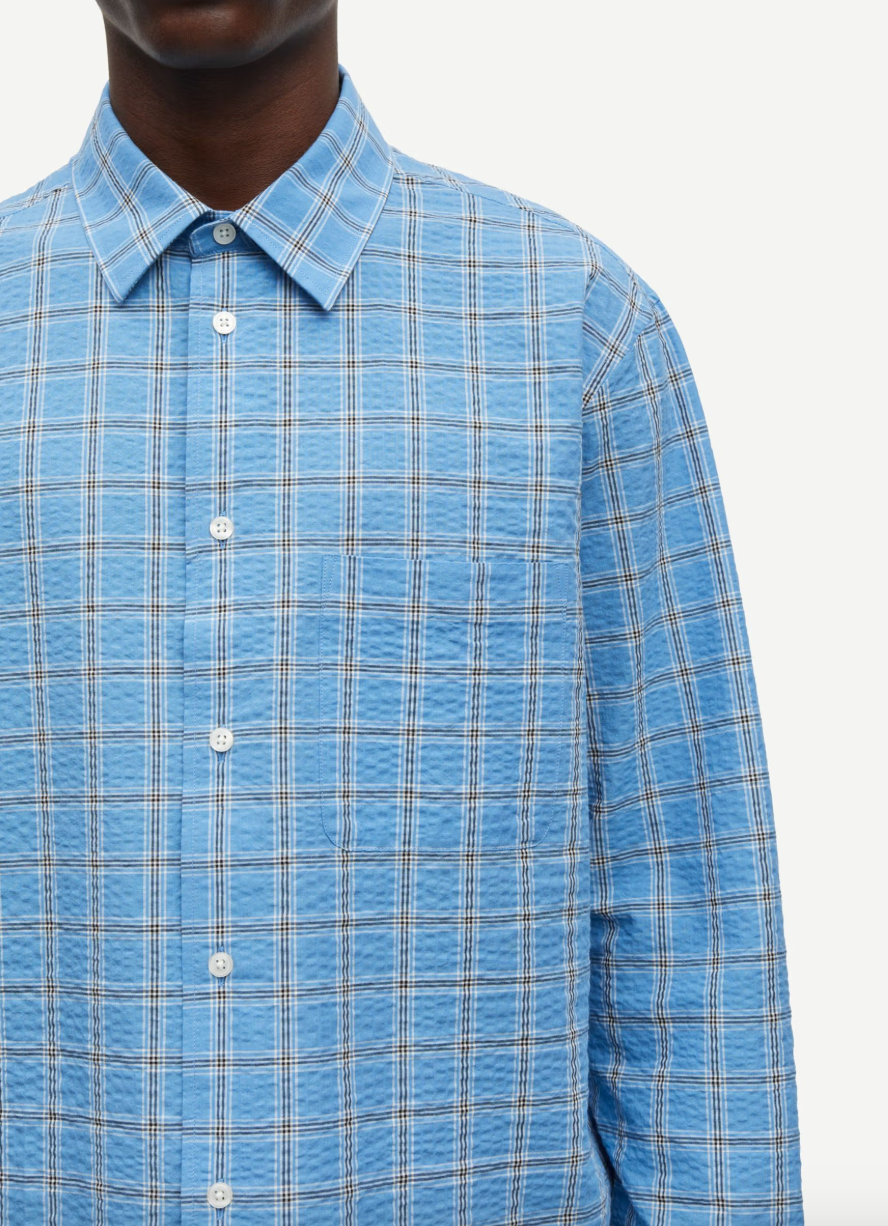 long sleeve shirt with blue check print and cheese cloth like fabric close u