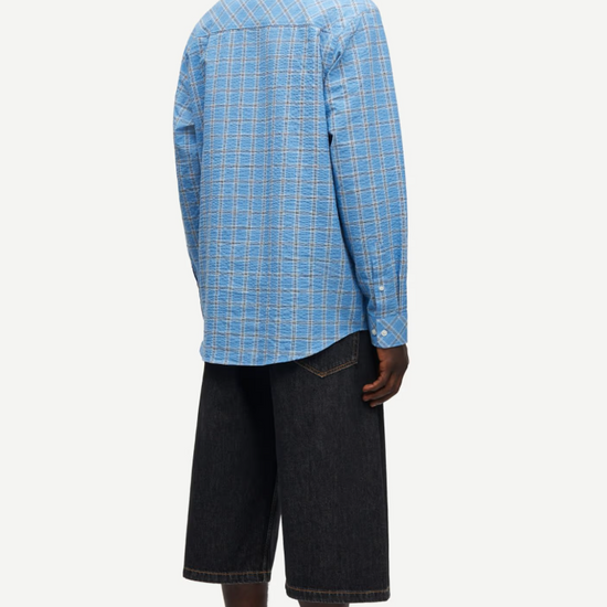 long sleeve shirt with blue check print and cheese cloth like fabric rear view