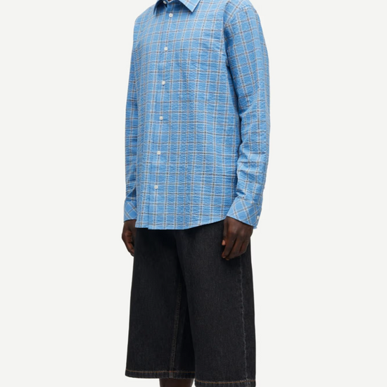 long sleeve shirt with blue check print and cheese cloth like fabric side view