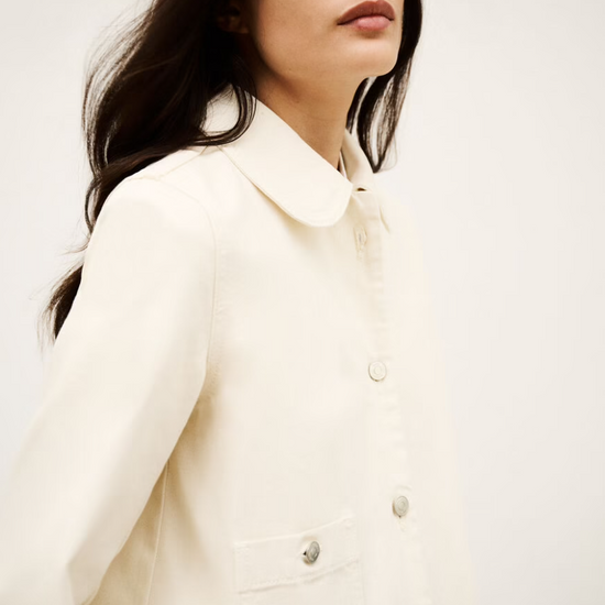 ecru cotton jacket with peter pan collar, 1 patch pocket and silver buttons side view