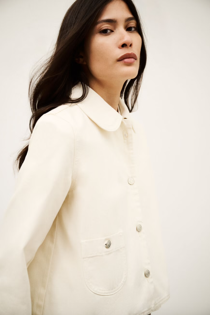 ecru cotton jacket with peter pan collar, 1 patch pocket and silver buttons side view