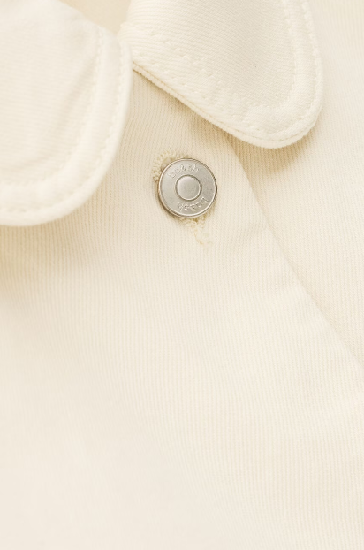 ecru cotton jacket with peter pan collar, 1 patch pocket and silver buttons close up