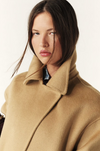 camel wool coat with concealed placket, tie belt which loops through the coat and side pockets close up