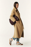 camel wool coat with concealed placket, tie belt which loops through the coat and side pockets side view