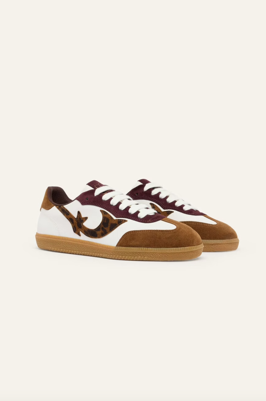 white leather trainers with brown suede to, back and animal print design on the side