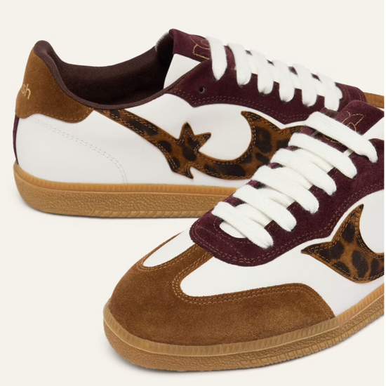 white leather trainers with brown suede to, back and animal print design on the side 