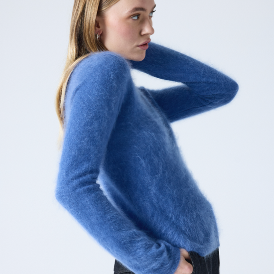 denim blue crew neck cashmere jumper with long sleeves and hairy textured feeling side view