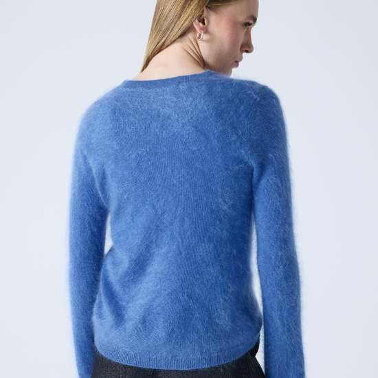 denim blue crew neck cashmere jumper with long sleeves and hairy textured feeling rear view