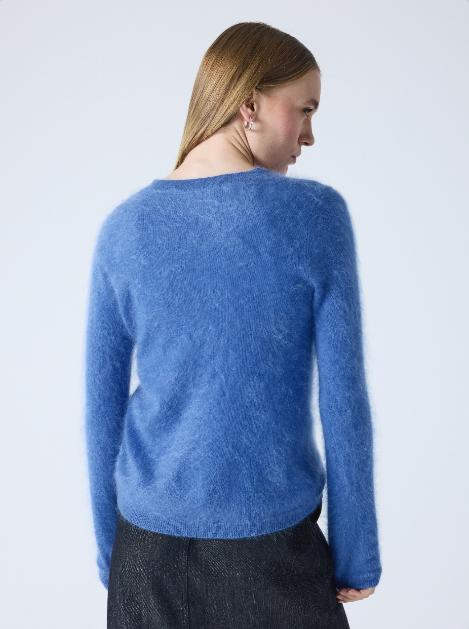 denim blue crew neck cashmere jumper with long sleeves and hairy textured feeling rear view