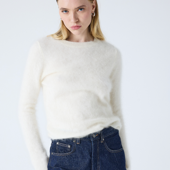 cream crew neck jumper with long sleeves and fluffy texture