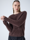 brown crew neck jumper with long sleeves and fluffy texture model shot