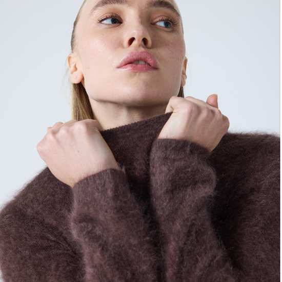 brown crew neck jumper with long sleeves and fluffy texture model shot