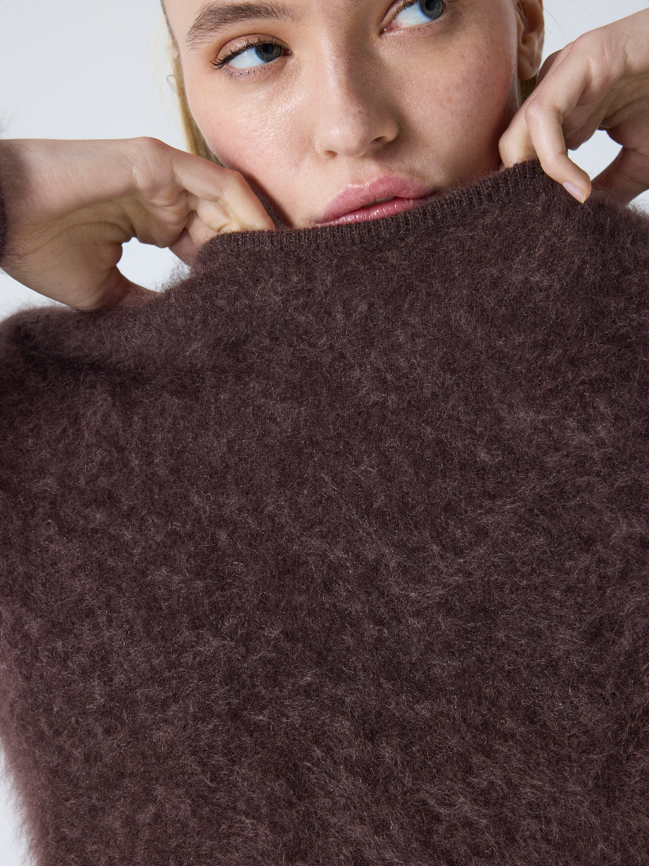 brown crew neck jumper with long sleeves and fluffy texture close up